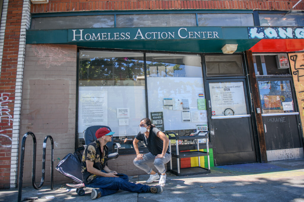 HAC advocate assists a client outside the Berkeley HAC office during drop-in hours.